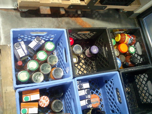 Crates filled with glass jars.